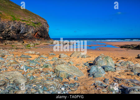 Beautiful Church Porth Beach on a bright summer morning with deep blue sky. Stock Photo
