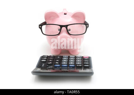 Piggy bank and calculator on white background. Savings and budget concept Stock Photo