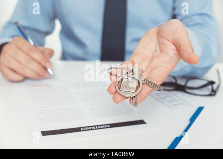 Real estate agent with home keys. Buying a new apartment concept Stock Photo