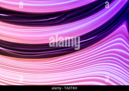 Futuristic abstract background of beautiful glowing neon colorful lines with gradient from pink to violet. Stock Photo