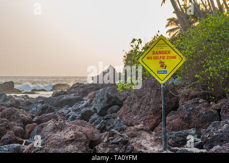 A sign on a beach warning for selfies. Stock Photo