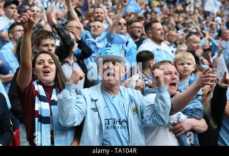 London, UK. 18 May 2019 Man City fans celebrate during the Emirates FA Cup Final between Manchester City and Watford at the Wembley Stadium in London. 18 May 2019. EDITORIAL USE ONLY. No use with unauthorized audio, video, data, fixture lists, club/league logos or 'live' services. Online in-match use limited to 120 images, no video emulation. No use in betting, games or single club/league/player publications. Credit: James Boardman / Alamy Live News Stock Photo