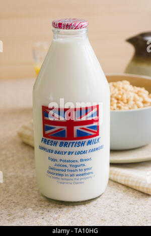 Fresh semi skimmed milk in a recyclable glass bottle delivered to the door step by a traditional milk man Stock Photo