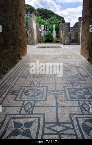 Excavated mosaic floor in ruined villa  in Pompeii  the ancient Roman city near Naples in the Campania region of Italy Stock Photo