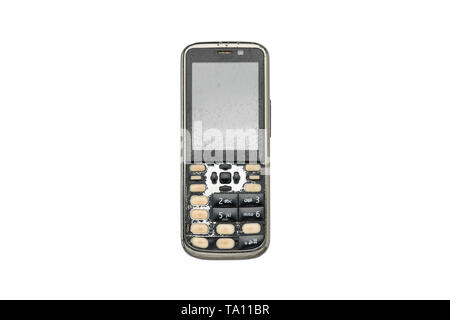 very old and broken mobile phone, isolated on white Stock Photo