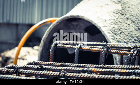 Dowel bar Steel for reinforcement structure to column, beam, floor with background concrete mixer equipment tool. Stock Photo