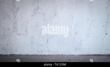 The grunge white concrete old texture wall, concrete floor, modern loft style idea design. Stock Photo