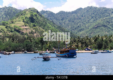 BALI, INDONESIA - December 01, 2013: Approaching the coast of Lombok, Balis neighbouring Island, by Boat on a beautiful day blue skies. Stock Photo