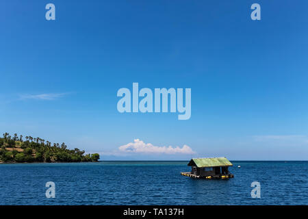 BALI, INDONESIA - December 01, 2013: Floating wooden House just off the coast of Lombok. Stock Photo