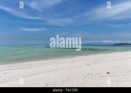 GILI AIR, INDONESIA - December 01, 2013: Pristine Waters and a white Sandy Beach on Gili Air. One of the three popular Gili Islands near Lombok. Stock Photo