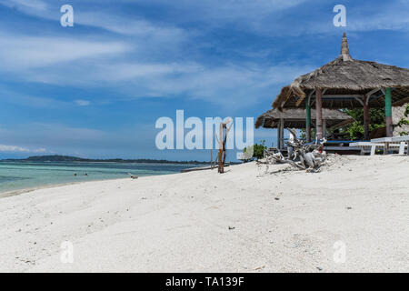 GILI AIR, INDONESIA - December 01, 2013: Pristine Waters and a white Sandy Beach on Gili Air. One of the three popular Gili Islands near Lombok. Stock Photo