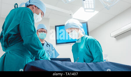 Medical doctors performing operation in hospital Stock Photo