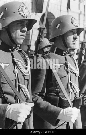 After the Anschluss of Austria to the German Reich, Austrian soldiers carry the German national insignia (Reichsadler). Stock Photo