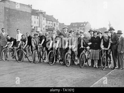 The drivers of a track cycling race on the Ruettbahn in Berlin's Polizeistadion are ready to start the race. Stock Photo