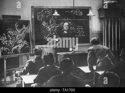 School scene from the movie 'The Blue Angel' (director: Josef von Sternberg) with actor Emil Jannings as professor Immanuel Rath. Stock Photo