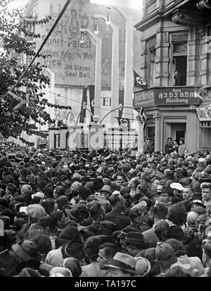 Waiting visitors in front of the Sportpalast on September 26, 1938, in Berlin. They are listening to a speech held by Adolf Hitler concerning the occupation of the Sudetenland by German troops. Stock Photo