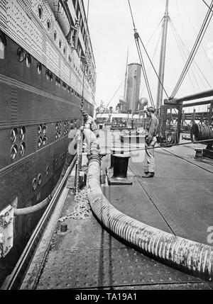 The 'Majestic' of the White Star Line is being fueled. Stock Photo