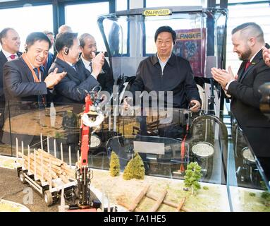 Vienna, Austria. 19th May, 2019. Li Zhanshu (2nd R), chairman of the Standing Committee of the National People's Congress (NPC), visits Palfinger, an Austria-based crane manufacturing company, in Salzburg, Austria, on May 19, 2019. China's top legislator Li Zhanshu paid an official friendly visit from May 18 to 21 to Austria, where he met with Austrian leaders on promoting bilateral ties and expressed China's stance on upholding multilateralism and free trade. Credit: Huang Jingwen/Xinhua/Alamy Live News Stock Photo