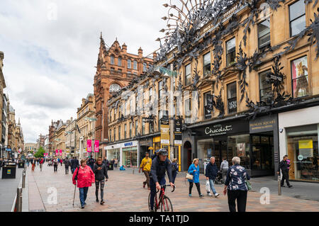 View of shoppers and shops on Buchanan Street the main pedestrian shopping street in Glasgow, Scotland, UK Stock Photo