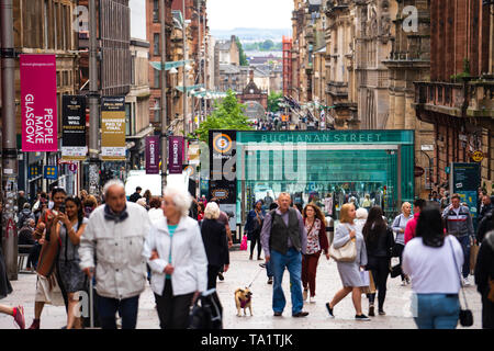 View of shoppers and shops on Buchanan Street the main pedestrian shopping street in Glasgow, Scotland, UK Stock Photo