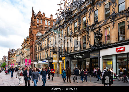 View of shoppers and shops on Buchanan Street the main pedestrian shopping street in Glasgow, Scotland, UK Stock Photo