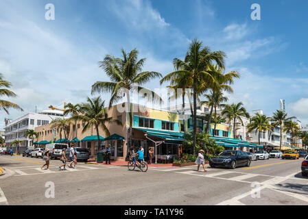 Miami, FL, USA - April 19, 2019: The Mango's Tropical Cafe on the Ocean Drive at the historical Art Deco District of Miami South Beach with hotels, ca