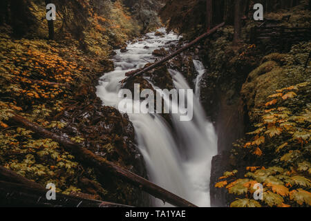 Long exposure of a waterfall known as Sol Duc Falls at Olympic National Park, Washington, USA in the fall Stock Photo