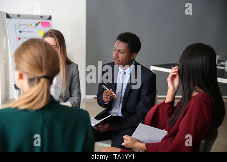 People at NLP training in office Stock Photo