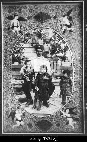 The Cossack colonel and later Shah of Iran, Reza Pahlavi with his three children, the heir to the throne and later Shah of Persia Mohammad Reza Pahlavi, Princess Ashraf and Princess Sham (from left to right). Stock Photo