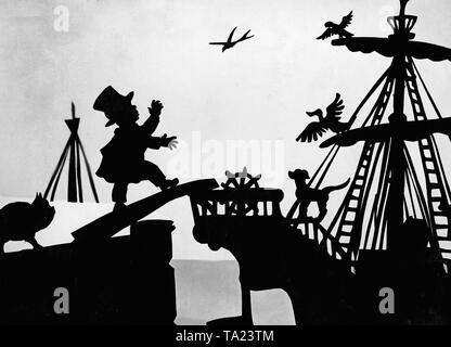 This photo shows a scene from the silhouette film 'Dr. Dolittle and His Animals' - subtitle: 'The Trip to Africa' by Charlotte Reiniger. The silhouette film, also known as silhouette animation, is a technique of animated film in which silhouettes are put together on a lighted glass plate in front of a white or black background to form a film. The result is the silhouette film, inspired by shadow theater and the pictorial techniques of silhouette cutting.