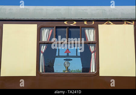 Frontal view of a window of the vintage steam train 'Quantock Belle', stationed in Bishops Lydeard, Somerset, UK. Stock Photo