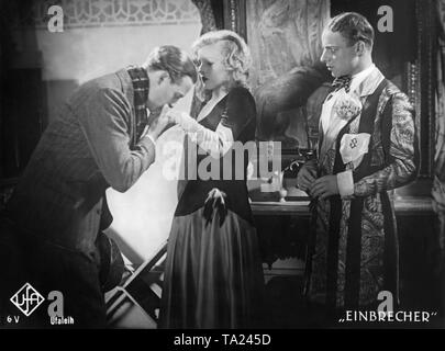 Willy Fritsch as Durand (left), Lilian Harvey as Renee and Heinz Ruehmann as Serigny in the feature film 'Burglars' by Hanns Schwarz. Stock Photo