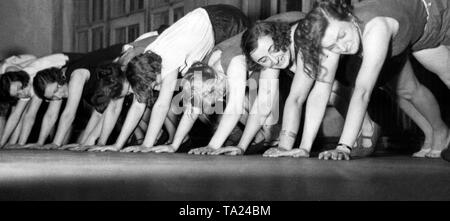 A group of women do sports exercises in the course of an action of the Nazi organization 'Kraft durch Freude' ('Strength through Joy'). Undated photo. Stock Photo