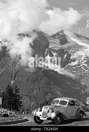 Hanomag 'Sturm' sports sedan on the Grossglockner High Alpine Road. At the wheel the racing driver Karl Haeberle. Hannoversche Maschinenbau AG was a company founded in 1871 that produced locomotives, lorries, tractors, passenger cars and construction machinery Stock Photo