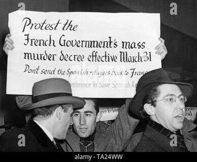 Photo of a protester during a demonstration for the rescue and better treatment of refugees of the Spanish Civil War in front of the French consulate on 5th Avenue (49th Street) on March 29, 1940. The gathering was organized by the Emergency Committee to Save Spanish Refugees. Some protesters were arrested during the dissolution of the gathering by the police. Stock Photo