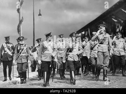 Emperor Wilhelm II (3rd from left), Tsar Nicholas II (4th from left) and Grand Duke Nikolai Nikolaevich (5th from left) take the salute of the Vyborg regiment at the leaders meeting in Baltischport. Stock Photo