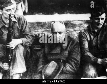 The former head of the German Labor Front, Robert Ley, guarded by American soldiers after his arrest in Bavaria, Germany, 1945 Stock Photo