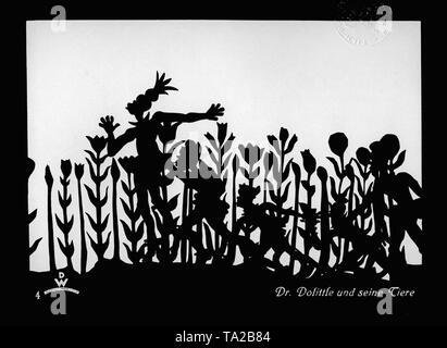 This photo shows a scene from the silhouette film 'Dr. Dolittle and his Animals' by Charlotte Reiniger. The silhouette film, also known as silhouette animation, is a technique of animated film in which silhouettes are put together on a lighted glass plate in front of a white or black background to form a film. The result is the silhouette film, inspired by shadow theater and the pictorial techniques of silhouette cutting.
