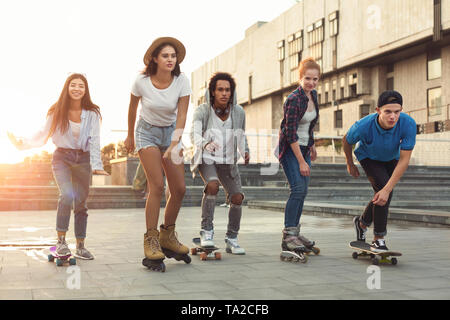 Group of teens making activities in urban area Stock Photo