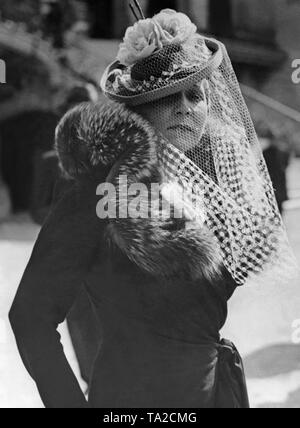 Woman wearing the latest hat fashion at the Paris racecourse 'Longchamp'. Stock Photo