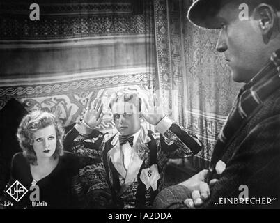 Lilian Harvey as Renee, Heinz Ruehmann as Serigny and Willy Fritsch as Durand in the feature film 'Burglars' by Hanns Schwarz. Stock Photo