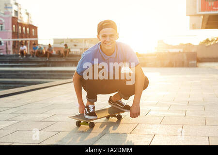 Skater Boy Riding on Skateboard in Skate Park Outdoor Stock Photo