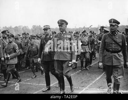 Elhard von Morozowicz (middle), Reichsfuehrer (federal leader) of the Wehrstahlhelm in the SA, and to his left, SA-Obergruppenfuehrer (senior group leader), Friedrich Ritter von Krausser, arrive at the Reich leadership meeting of the Stahlhelm in the stadium of Hanover. On the right, Bundesfuehrer (federal governor), Franz von Seldte. Stock Photo