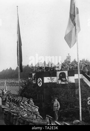 The leaders of the Stahlhelm, who have gathered for a meeting at the Masch in Hanover, are greeting the marching flagbearers .3rd from the right, on the VIP stand in front of a standard, Bundesfuehrer (federal leader) Franz Seldte. Stock Photo