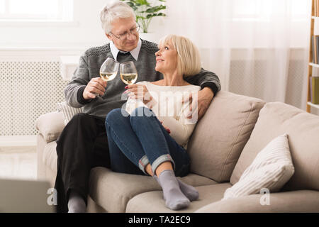 Mature Couple Drinking White Wine At Home Stock Photo