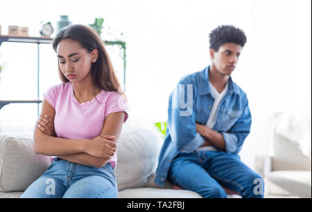 Black Teenage Couple Sitting Separate After Argument