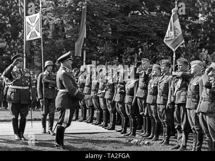 Photo of Field Marshal General, Hermann Goering (commander-in-chief of the Luftwaffe) welcoming pilot officers of the Condor Legion in the Moorweide (Hamburg) at Hamburg Dammtor on May 30, 1939. General der Flieger Hugo Sperrle is saluting to his left. Stock Photo