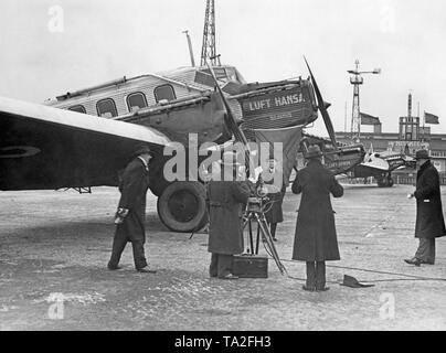 Shooting of a sound film on an airfield. In the background, various aircrafts of the Lufthansa. Stock Photo