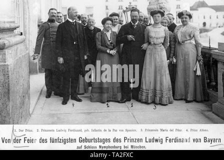 This photograph shows the invited guests celebrating the 50h birthday of Prince Ludwig-Ferdinand of Bavaria at Nymphenburg Palace in Munich. From left: Prince Alfons, brother of Prince Ludwig-Ferdinand, Princess Maria de la Paz of Spain, wife of Prince Ludwig-Ferdinand, dr. Prince Ludwig-Ferdinand and Princess Maria del Pilar, wife of Prince Alfonso. Besides his occupation as a physician, Prince Ludwig Ferdinand was also General of the Cavalry, General of the Royal Spanish Army Medical Corps and Honorary Surgeon of the Royal Spanish Academy, as well as artist and musician. Stock Photo