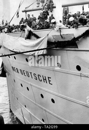 The new name label of the passenger steamer 'Sierra Morena' of the North German Lloyd is being unveiled. The passenger ship is now called 'Der Deutsche' on the order of the Nazi organization 'Kraft durch Freude'. Stock Photo